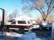 1987 Ford Ranger - Three vehicles, including a lifted Ford Bronco, sit in the snow on a clear winter day.