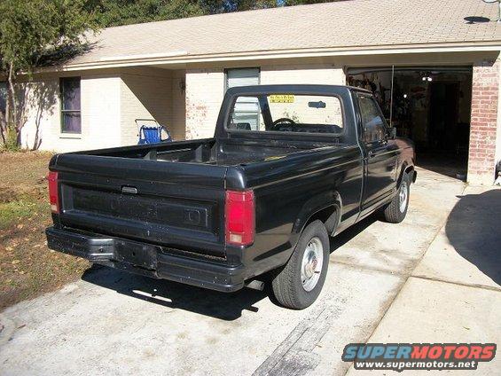 1987 Ford Ranger pickup truck parked in driveway, rear view