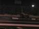 1994 Ford Bronco - A monster truck performs at a nighttime event with spectators in the background.