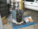 1972 Ford Ranchero - Engine block on a pallet, with tires and rims stacked nearby. A white car is visible in the background.