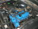 1972 Ford Ranchero - Engine bay view showing a blue V8 engine with a chrome air cleaner and visible wiring.