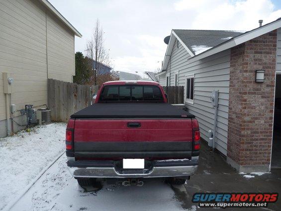 1997 Dodge 2500 pickup truck rear view, parked in driveway with snow on the ground