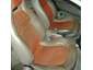 Close-up of an orange and white plastic car interior component