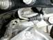 1980 Honda CB750 - Close-up of a motorcycle's brake cable assembly, showing mechanical components and wiring.