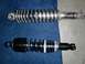 1980 Honda CB750 - Comparison of two motorcycle shock absorbers, one with a chrome spring and the other with a black spring and housing.
