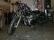 1980 Honda CB750 - Motorcycle project in a garage, showing the engine and front wheel assembly.