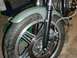 1980 Honda CB750 - Close-up view of a motorcycle's front wheel, brake assembly, and fender, with a watermark at the bottom right.