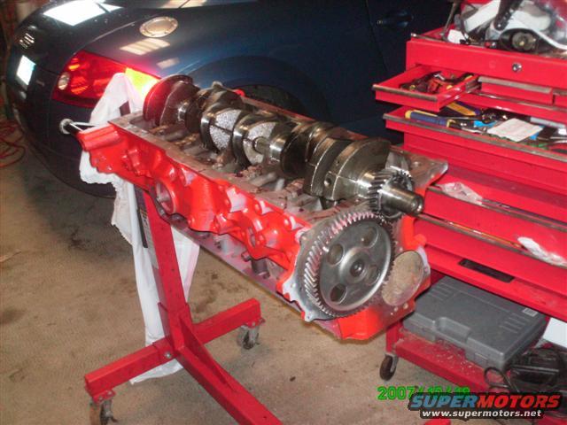 Crankshaft getting installed in block.