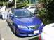 2003 Mazda 6 - A blue 2003 Mazda 6 sedan is parked on a street, seen from a 3q-front angle.