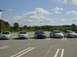 2003 Mazda 6 - Several Mazda 6 sedans are parked in a lot under a partly cloudy sky. The vehicle on the far right has a watermark for SuperMotors.net.