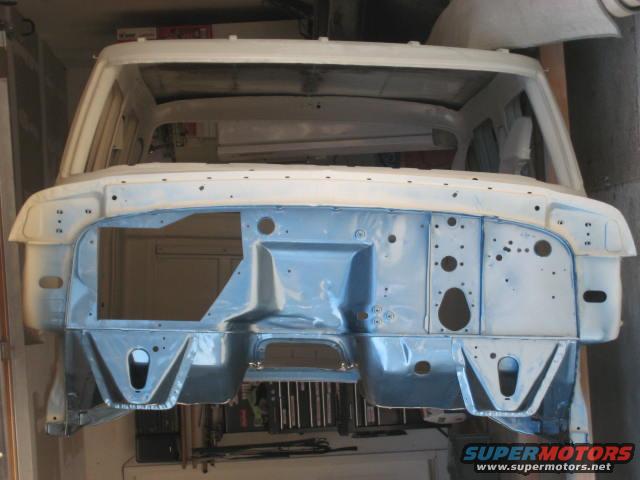 White truck cab front end, stripped down for restoration
