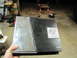 1993 Ford F-250 - A car amplifier with the MA audio logo is held in a hand, with a workshop in the background.