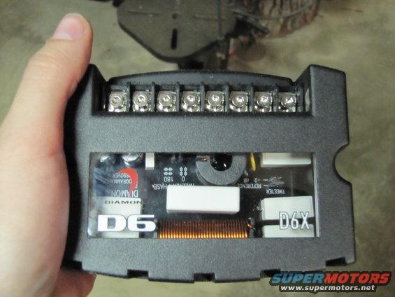 Car audio crossover with D6 and D6X labels, held in hand