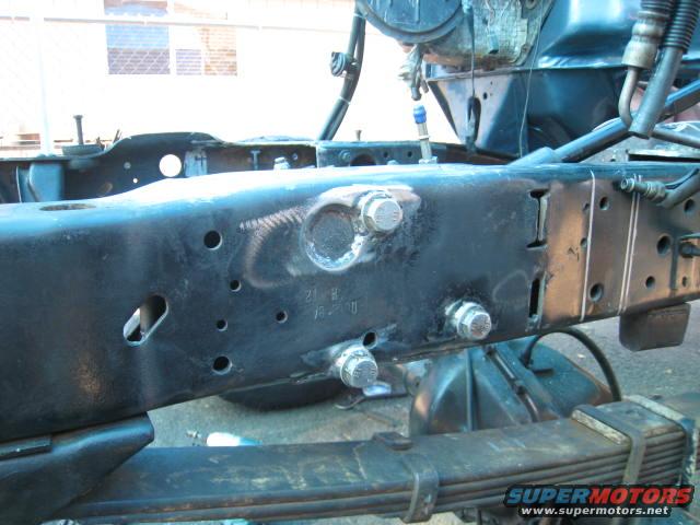 Truck frame with suspension components and bolts