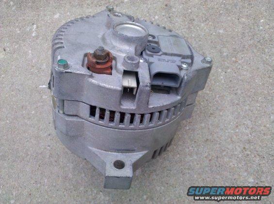 Automotive alternator with metal casing and electrical connectors