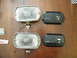 1968 Mercury Cougar - Pair of Lucas fog lights and their protective covers are laid out on a wooden surface.