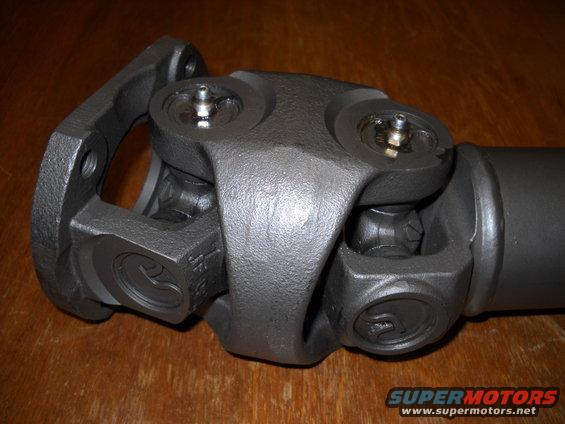 Close-up of a driveshaft U-joint with grease fittings