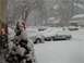 1972 Ford Ranchero - A winter scene shows multiple vehicles buried under a blanket of snow on a residential street.