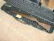 2003 Ford Crown Victoria - A wooden-stocked M1 Carbine rifle rests in a protective carrying case.