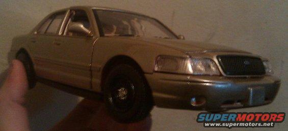 Gold 2000 Mercury Grand Marquis model, 3q front view