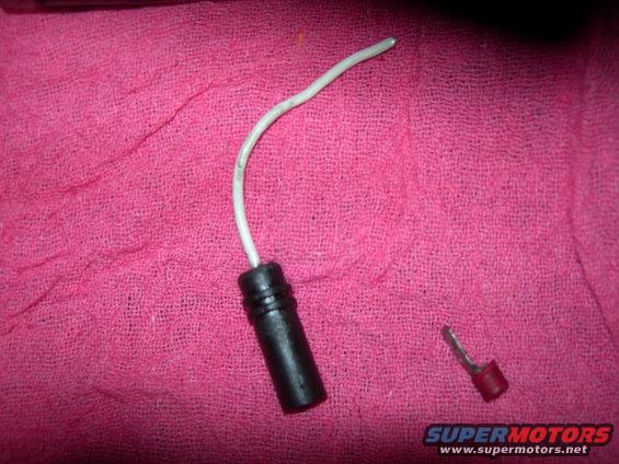 electrical connector with white wire and a separate red-capped terminal