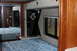 2003 Ford F-350 - Interior view of an RV bedroom, a bed and mirrored closet doors.