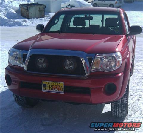 Front view of a red pickup truck with an Alaska license plate