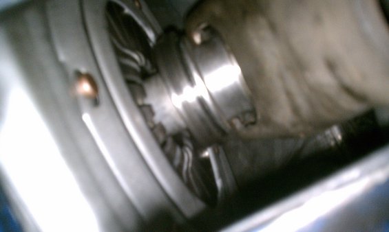 Close-up of a car's wheel hub and brake components, possibly showing wear or damage