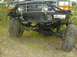 1996 Ford Bronco - This Ford Bronco features a lifted suspension and off-road tires, suggesting it is modified for rough terrain.