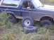 1996 Ford Bronco - This 1996 Ford Bronco appears to have multiple flat tires and is parked off-road.