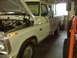 1973 Ford F-100 - This 1973 Ford F-100 pickup truck is parked inside a garage with its hood raised.