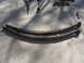 1994 Ford Bronco - Leaf springs and other suspension parts are shown on a concrete surface.
