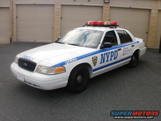 NYPD police car, front quarter view. Ford Crown Victoria with light bar