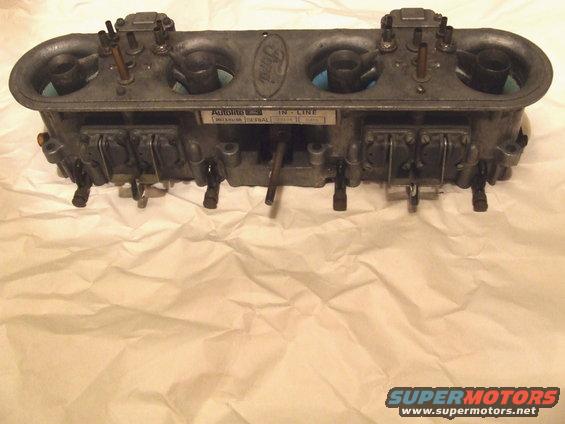 Ford Autolite inline carburetor with four barrels and a Ford oval logo