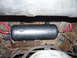 1991 Ford Bronco - Underside view of a vehicle showing an installed air tank and associated plumbing.