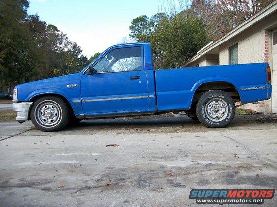Blue 1987 Mazda B2200 pickup truck, side view