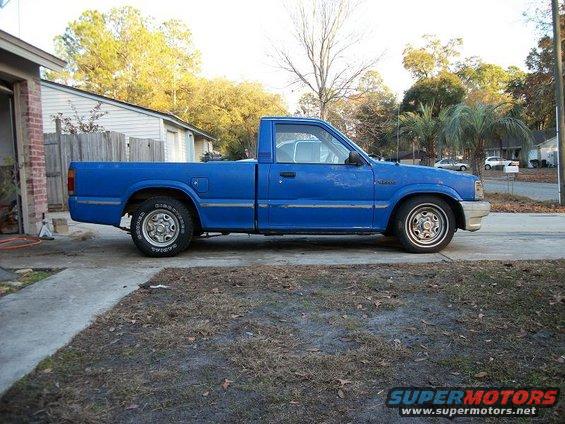1987 Mazda B2200 pickup truck, side view. Blue paint, single cab