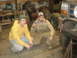 1995 Ford Bronco - Two men in a garage with the front of a 1995 Ford Bronco, which has a custom bumper.