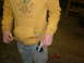 1995 Ford Bronco - A person stands in a workshop, holding a can and a cigarette, wearing a yellow hoodie.