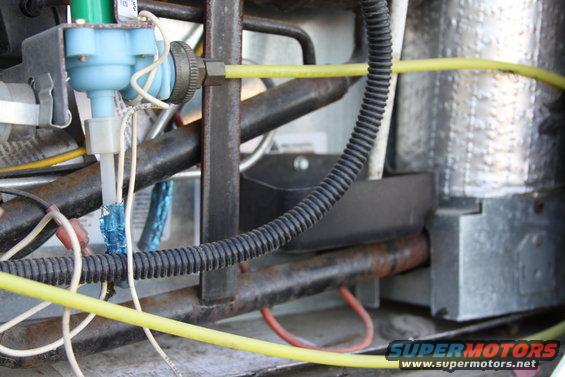 Close-up of water inlet valve and yellow tubing