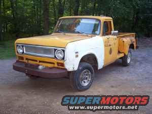 Yellow and white International pickup truck parked on dirt road