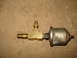 1985 Ford F-150 - A brass T-fitting with a pressure sensor attached is shown against a textured background.