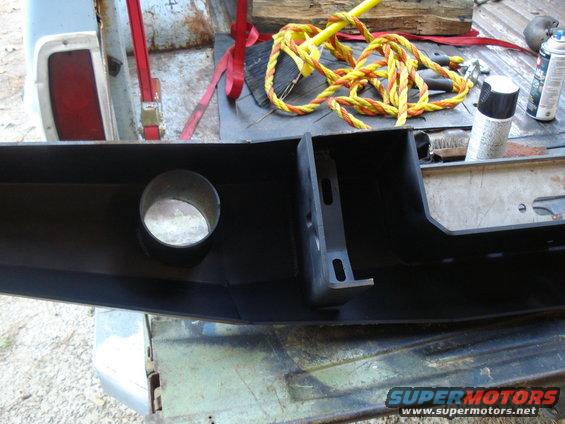 Black aftermarket bumper with circular cutout