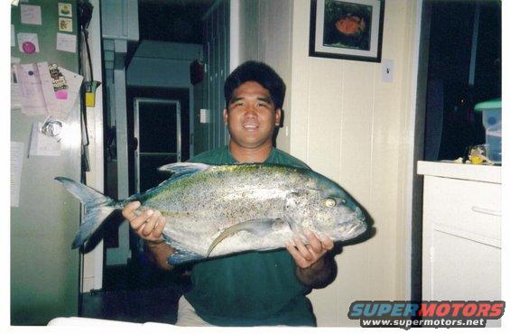 My brother in law Ryan Tambalo with his Papio (baby Ulua) caught spearfishing.