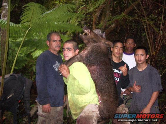 Richie with Tony and hog, with 2 Leleihua Mules, Rivers and Daquan, and DJ.
