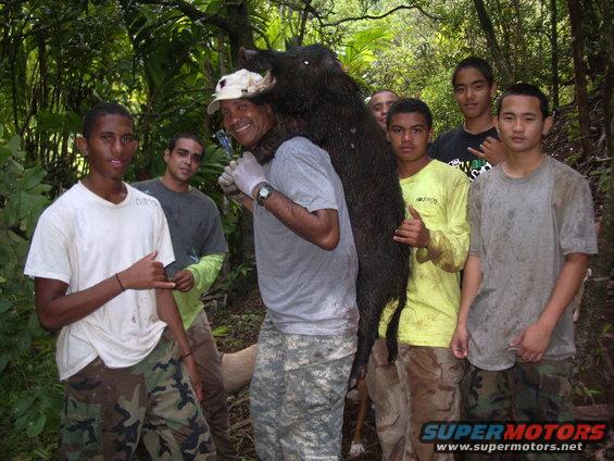 A guest with his son at left with Tony, Chris, Ikaika, Rivers and DJ. This gentleman just came back from Iraq and retired and they took him hunting for miles and he hung step for step  with the young bucks! Not bad for his very first time hog hunting.