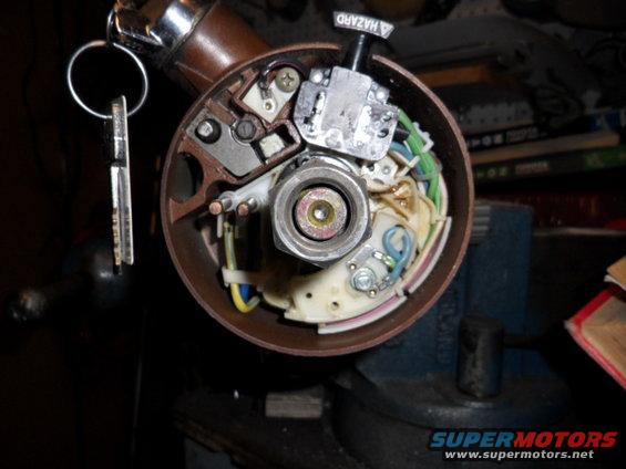 car ignition switch assembly with keys in a vise