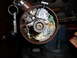 1973 Ford Ranchero - Close-up of a car's ignition switch assembly, held in a vise, with keys attached.