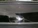1978 Ford Bronco - The rear window of a 1978 Ford Bronco shows significant damage, including cracks and a large spiderweb fracture.