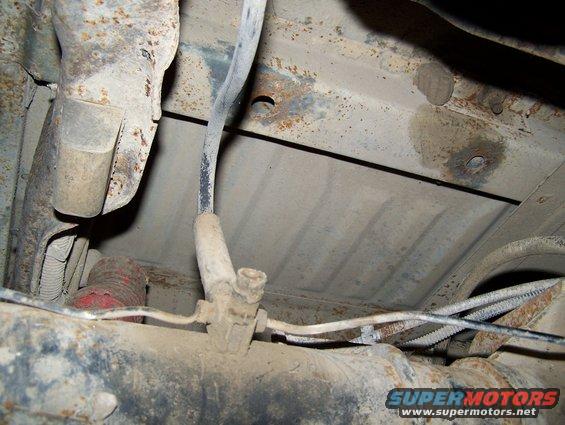 Undercarriage view showing suspension and fuel lines